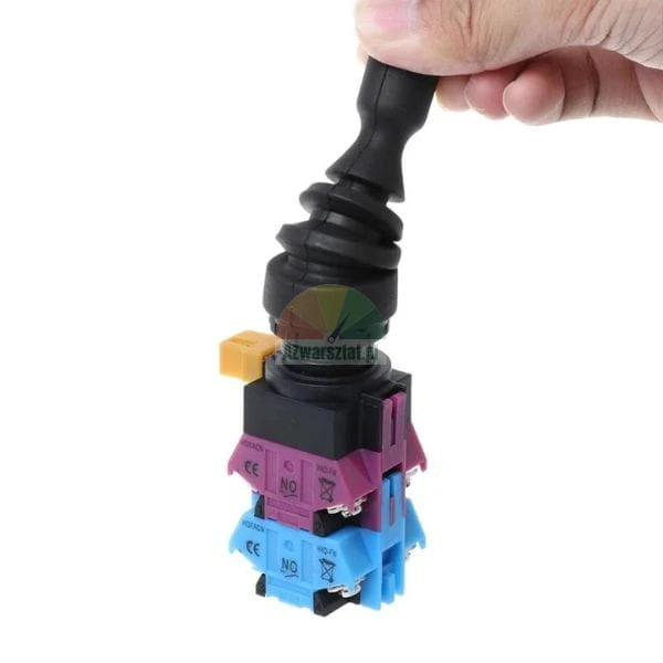 Industrieller Joystickschalter mit Gummimanschette und farbigen Kontaktblöcken.